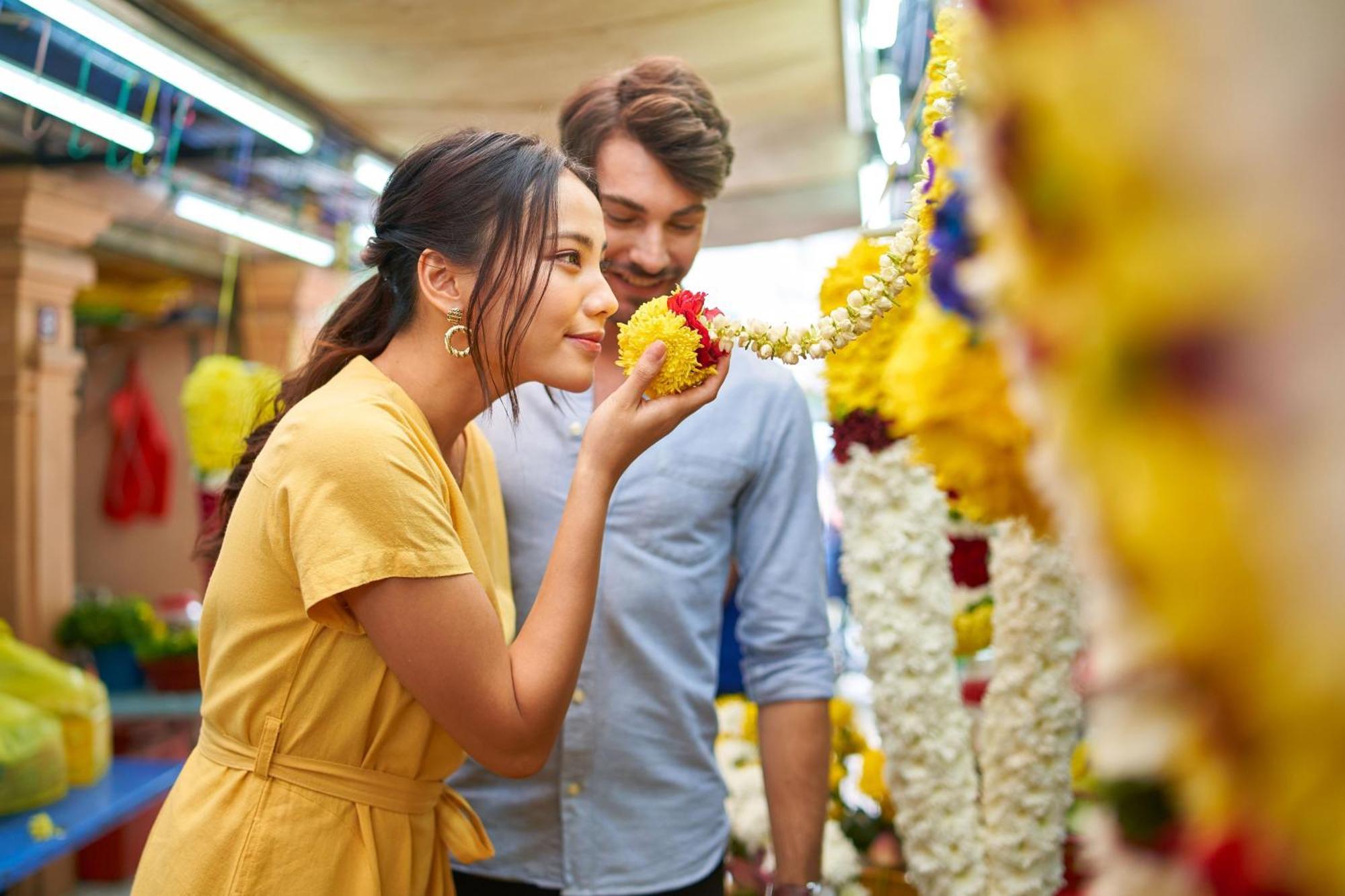 Le Meridien Kuala Lumpur Kültér fotó A woman smelling flowers
